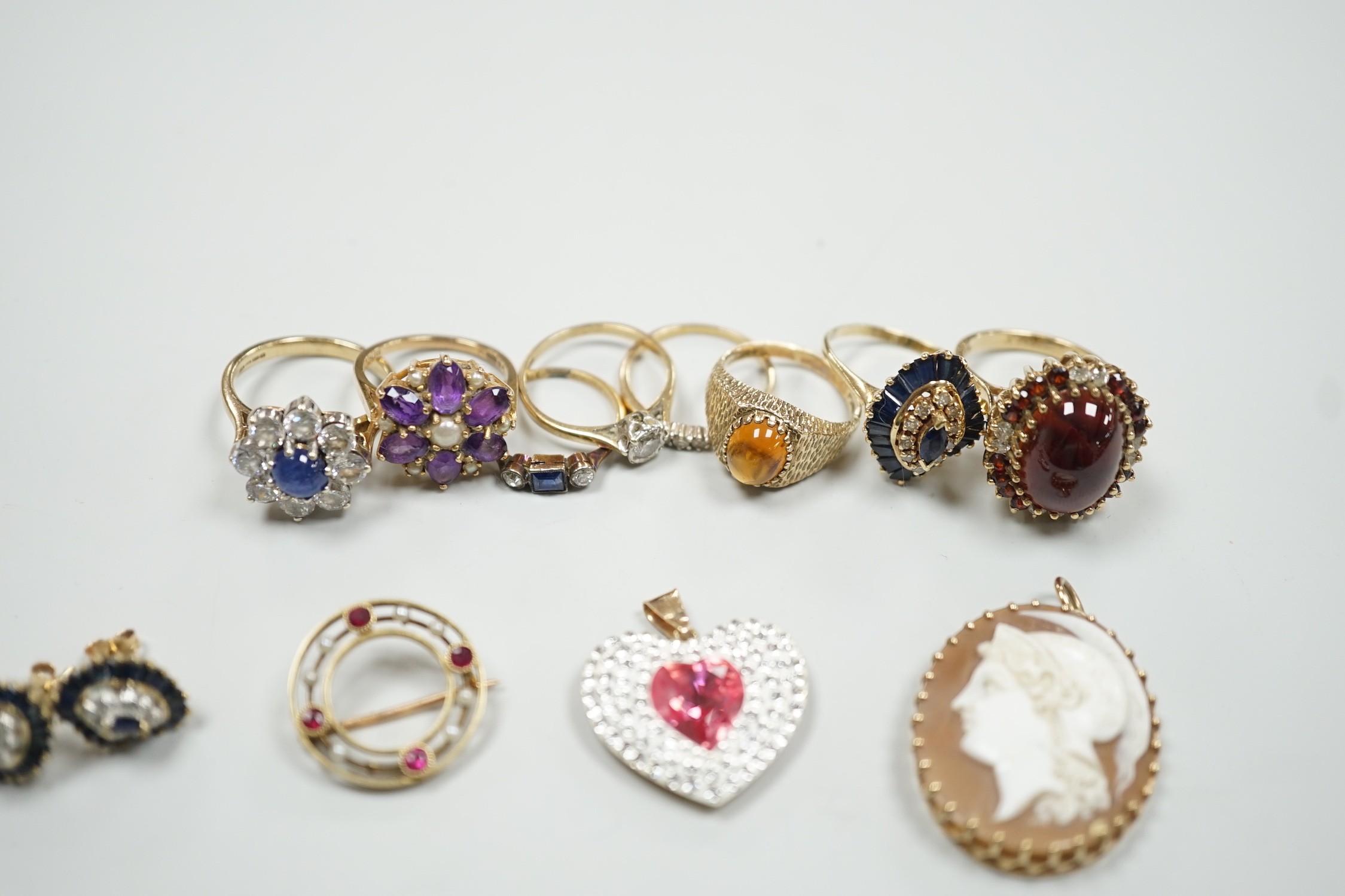 Eight assorted mainly modern 9ct gold and gem set dress rings, including amethyst and split pearl cluster, gross weight 30.7 grams, a 15ct, ruby and seed pearl set open work circular brooch, gross 2.6 grams, pair of 9ct,